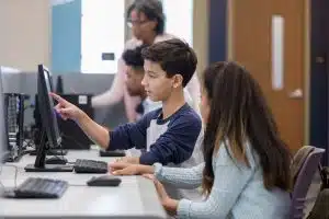 students work at a computer