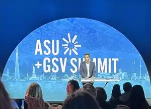 Roger Love leads a group singalong of "One Moment in Time" at ASU+GSV