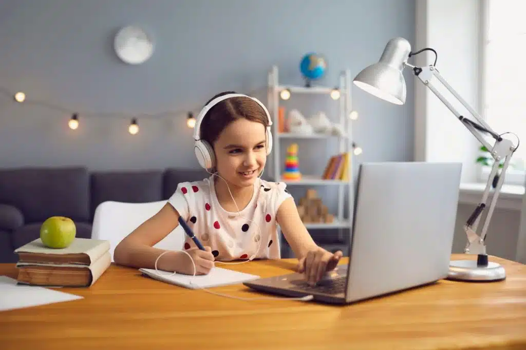 girl is engaged in online learning at home